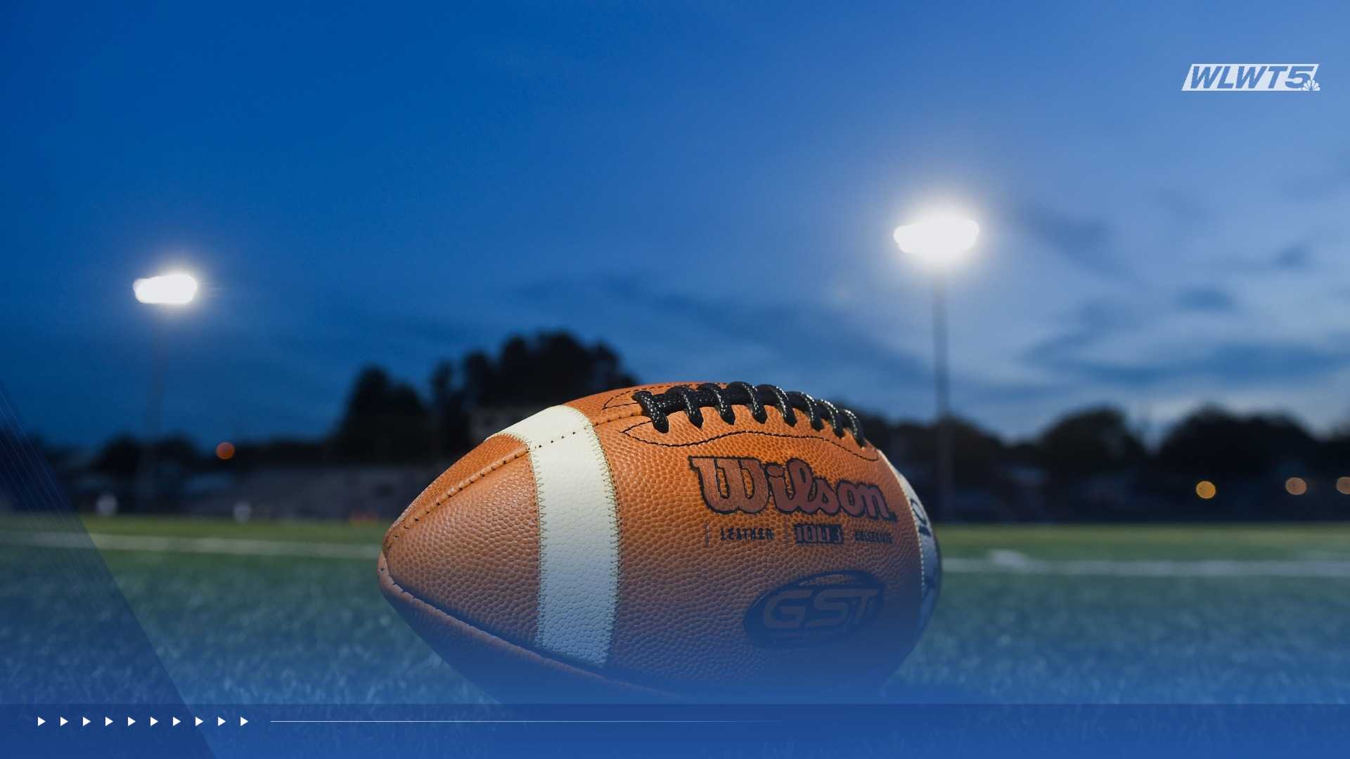 High school football players in action under the Friday night lights.